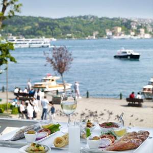 a plate of food on a table next to a body of water