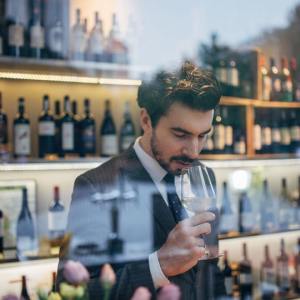 a man holding a glass of wine